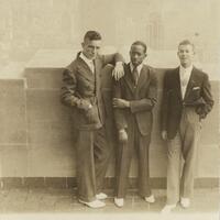 three young men Leaning Against a Wall